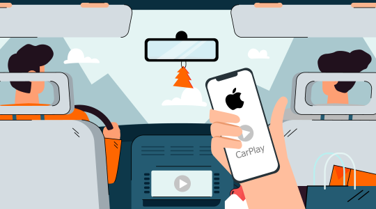 Blick aus dem Autofond, im Vordergrund hält eine Hand ein iPhone, auf dessen Display Carplay steht. Das Symbol wiederholt sich auf dem Bildschirm der Armaturenbrett. Das iPhone und das Auto sind miteinander verbunden.